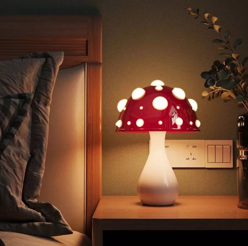 Mushroom-inspired home decor collection featuring whimsical mushroom lamps, LED night lights, a rain cloud mushroom humidifier, cozy tufted mushroom rug, and soft ambient lighting arranged in a warm, cozy aesthetic interior.